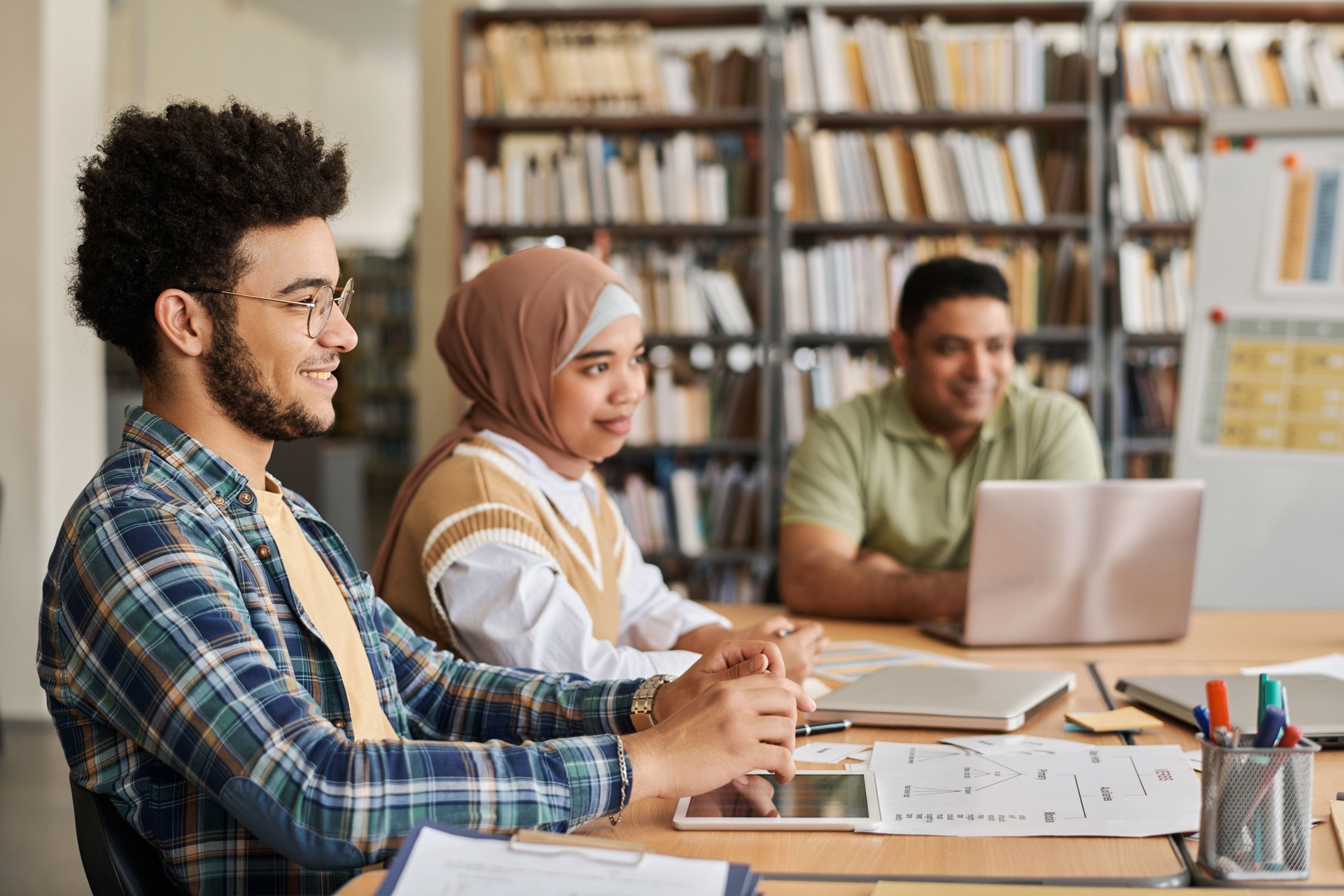 Migrant students studying foreign language in class